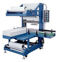 automatic sleeve wrapping machine (with heat shrink film) SBM 8040 American Packaging & Plant Equipment