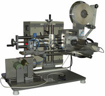 semi-automatic labeler for cylindrical products max. 25 p/min | C.M.E 211 St&eacute; ZAYANI C.M.E