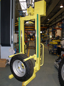 gripping manipulator / fork / for tires / pillar
