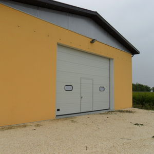 sectional doors / metal / exterior / hangar
