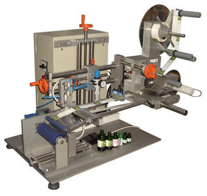 semi-automatic labeler / in-line / top / for cylindrical products