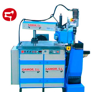 swing-arm tapping machine