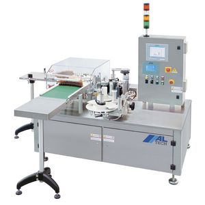 automatic labelling machine / for the pharmaceutical industry