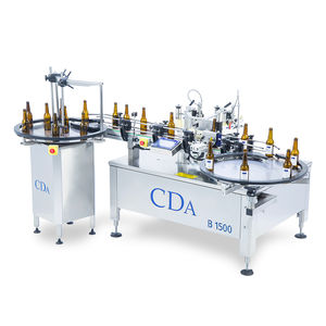 automatic labeler / for self-adhesive labels / for bottles / side
