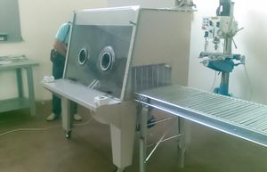 powder bag unloader