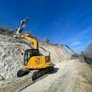 excavator drill attachment