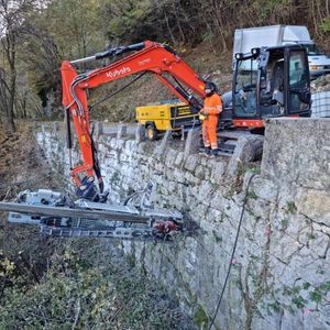 excavator drill attachment