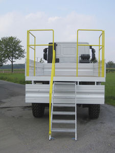 explosives transport and loading vehicle