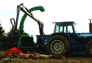 tractor-mounted wood chipper