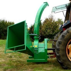 tractor-mounted wood chipper