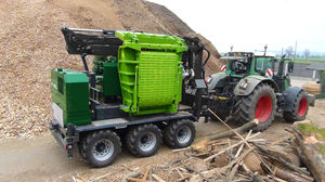 tractor-mounted wood chipper