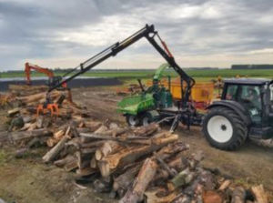 tractor-mounted wood chipper