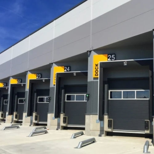 Sectional door - Loading Systems International - PVC / industrial / for loading docks