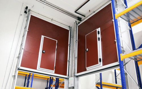 Vertical lift door - Kavidoors - stainless steel / anodized aluminum / indoor
