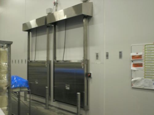 Vertical sliding door - MV0601K - DAN-doors - metal / for cold storage / industrial