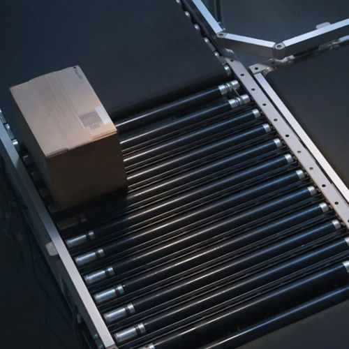 Case conveyor - DEMATIC - belt / roller / transport