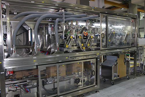 Continuous case packer - Technica International - automatic / bag / distribution