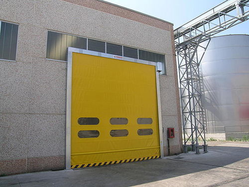 Fold-up door - Instant-Pass - Puertas Angel Mir - exterior / industrial / high-speed