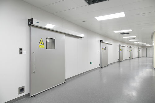 Sliding door - PUERTAS FERROFLEX SL - glazed / stainless steel / lead-lined
