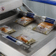 automatic packing machine / vacuum / double-chamber / for the food industry