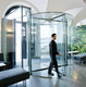 revolving door / rotating / stainless steel / glass