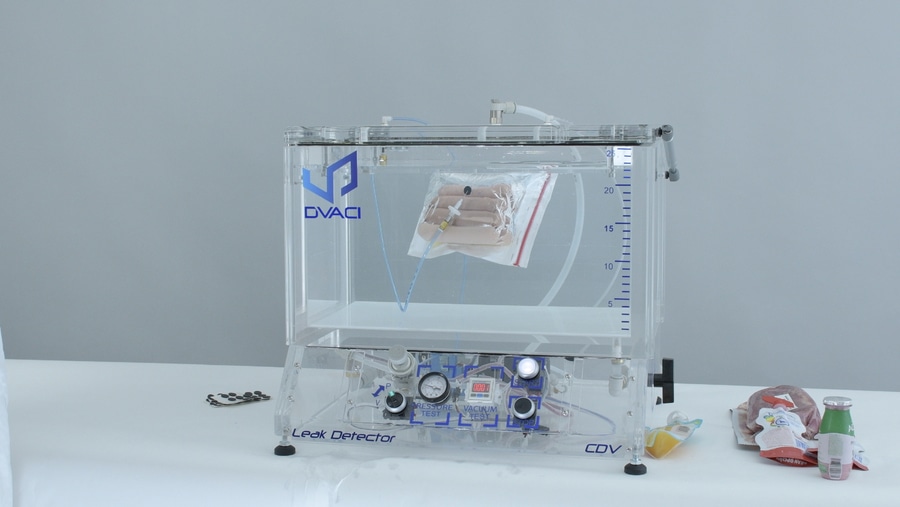 Leak testing for packaging with low air in head space or vacuum packed