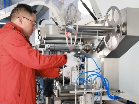 Figure 6 Engineer disassembling the machine