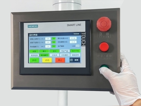 Figure 8 Engineer operating the Siemens PLC touch screen