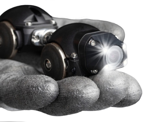 Miniature industrial inspection crawler iPIDRO held in a gloved hand
