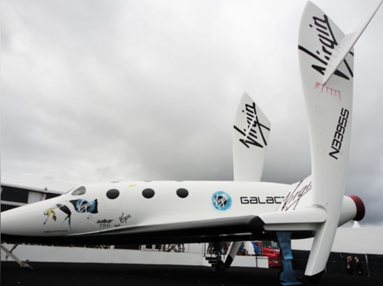 First SpaceShipTwo, with feathering system deployed, at the 2012 Farnborough International Airshow in Farnborough, U.K.