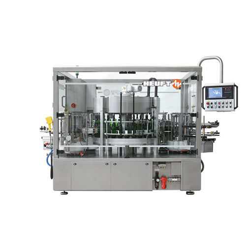 自動ラベル自動貼付機 - TORNADO W - HEUFT SYSTEMTECHNIK - ボトル用 / 飲料産業用 / ホットメルト接着剤使用