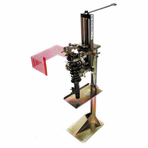 garra mecânica para compressão de molas