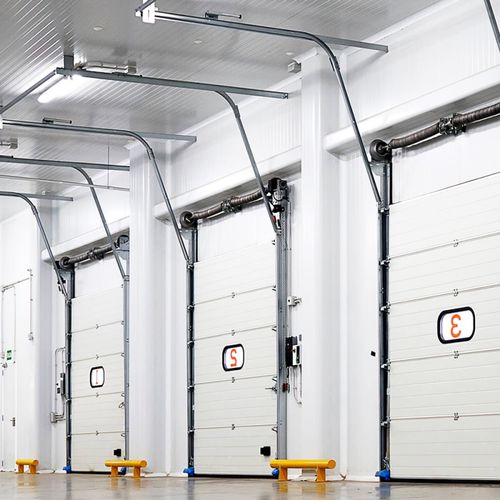 Porta seccionada - Infraca - para cais de carga / industrial