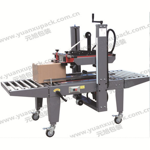Máquina fechadora de caixas de duas abas - YK-07B - Yuanxu Packing(shanghai) Machinery Co., LTD - fita adesiva / semiautomática