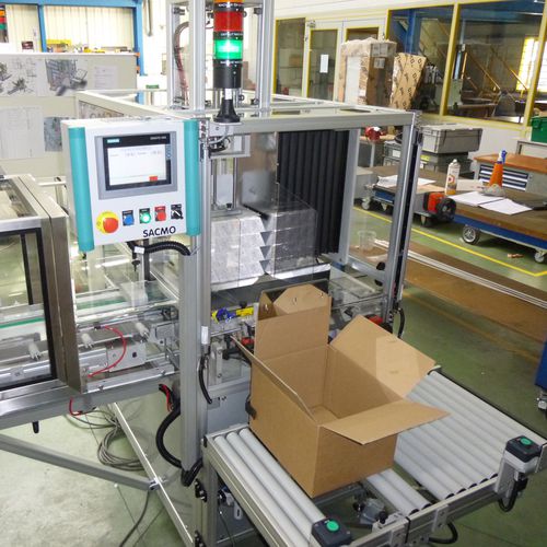 Encaixotadora lateral - SACMO - semiautomática / de pacotes / para caixas de papelão