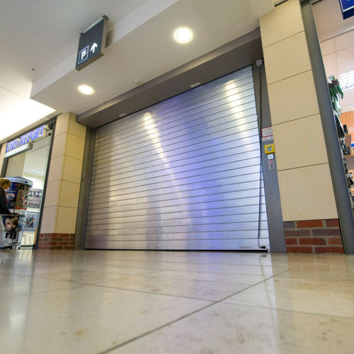 Porta de enrolar - ACOUSTICLINE 29-31 DB - Jansen Tore GmbH & Co.KG - em aço / acústica