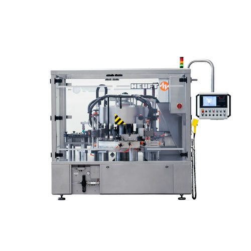 Rotuladora automática - TORNADO R - HEUFT SYSTEMTECHNIK - para garrafas / wrap-around / para a indústria das bebidas
