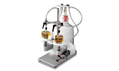Envasadora semiautomática - VACUFILL - Omas Tecnosistemi S.p.a. - para diversos tipos de recipientes / para líquidos / para perfumes