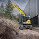 escavadeira de médio porte / de esteiras / a diesel / para construção civil