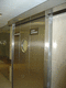 porta de correr / em aço inoxidável / em alumínio anodizado / para ambiente interno